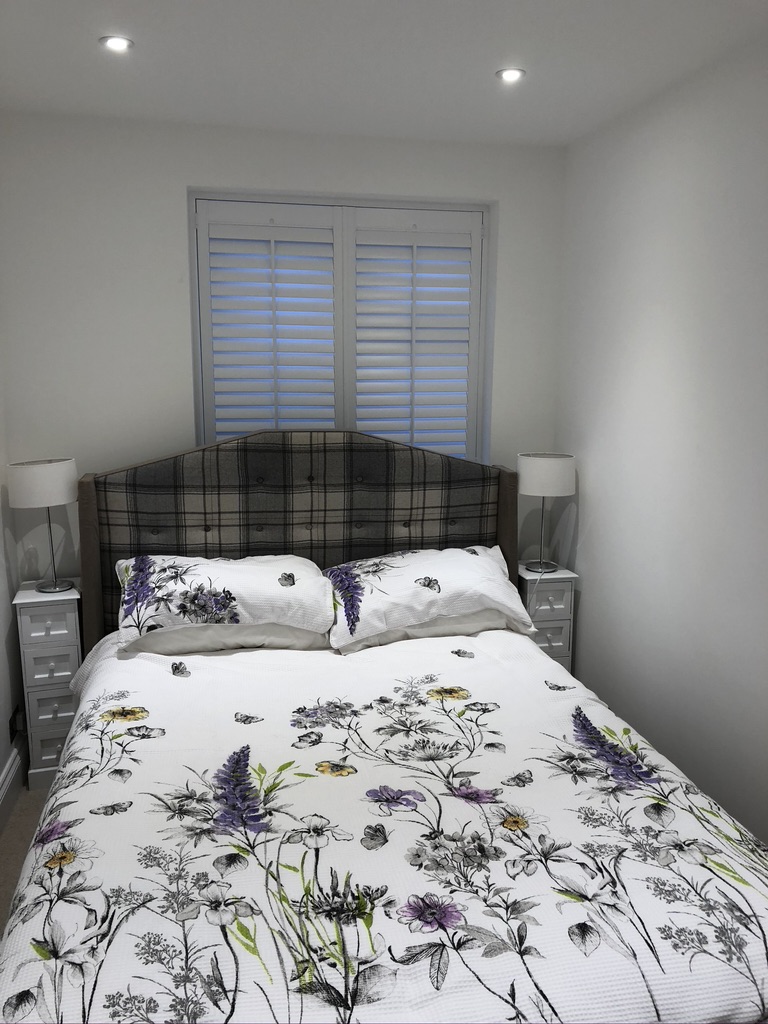 Full Height Grey Shutters in Stylish Bedroom Setting