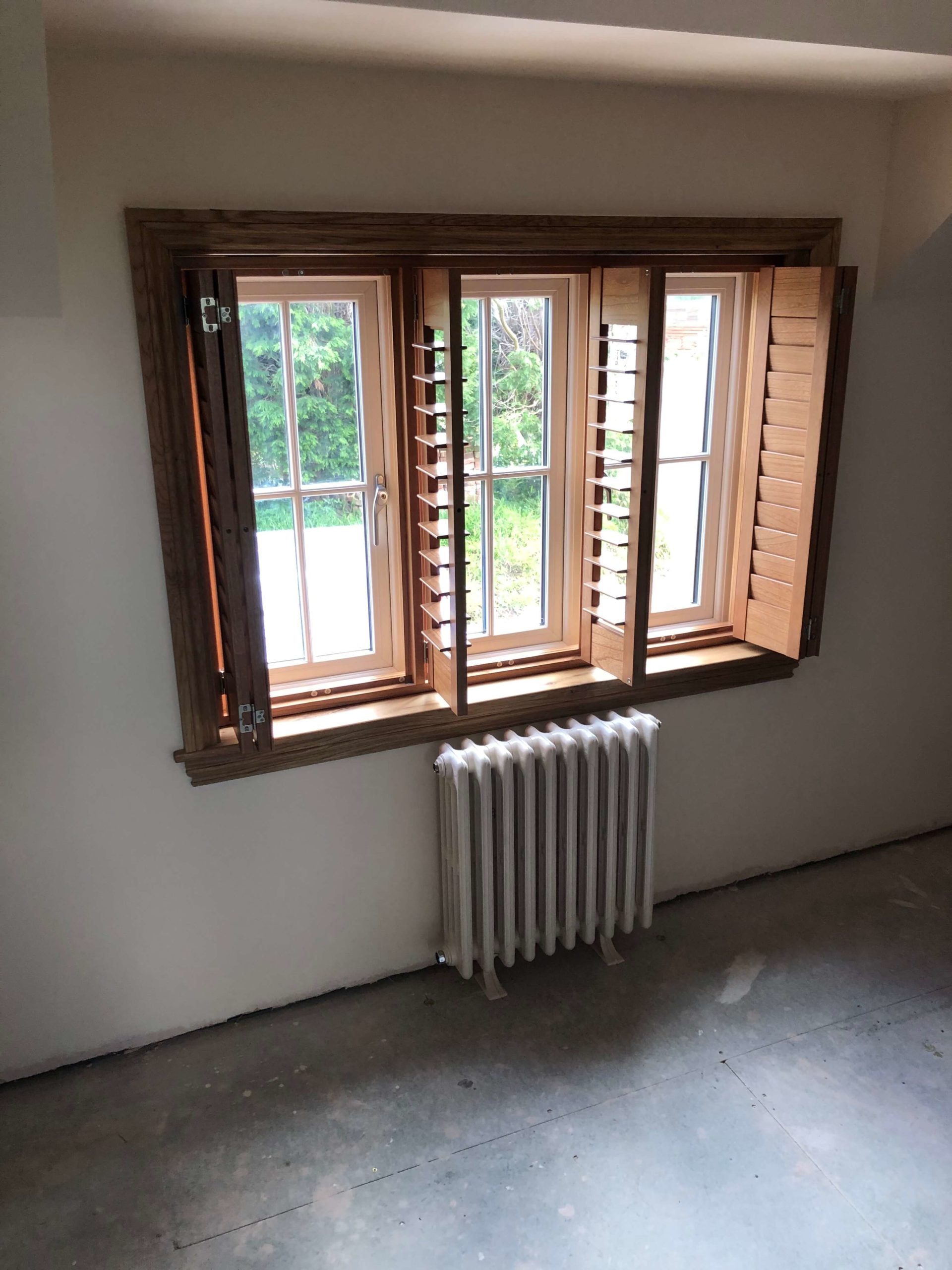 Stafford full height wooden shutters window
