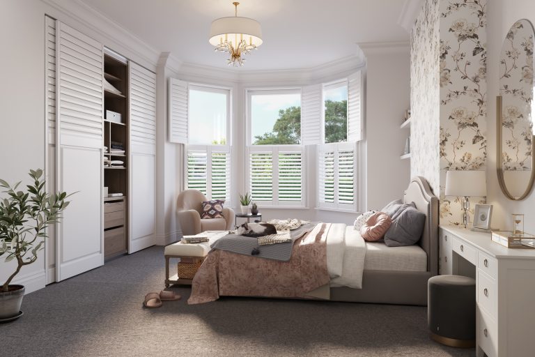 Image of a bedroom with shutters on the windows.