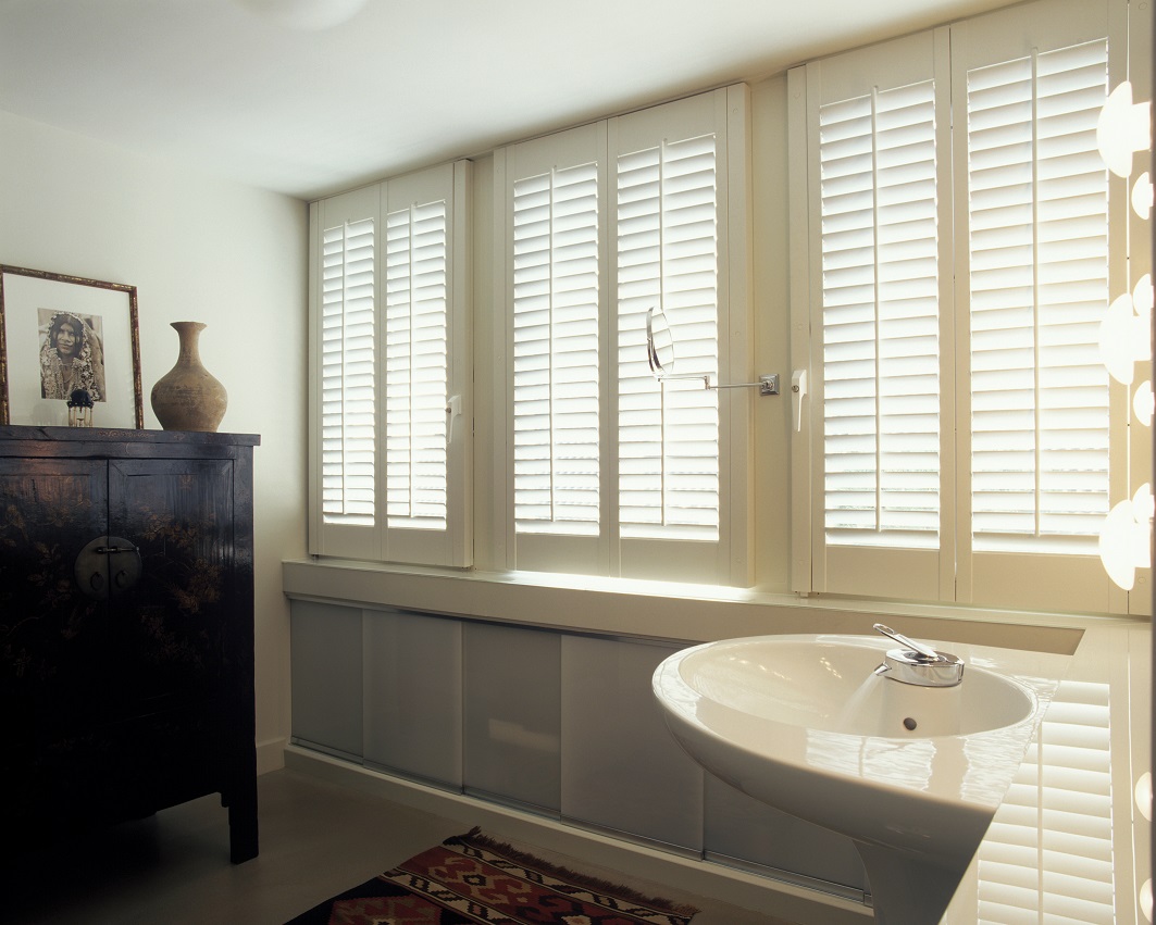 White shutters in a modern bathroom